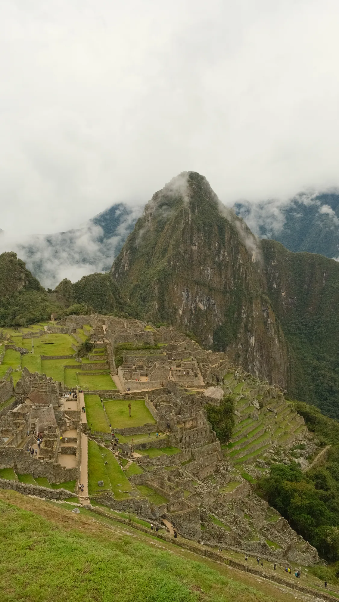 Stone walls and terraces at Machu Picchu, early afternoon.