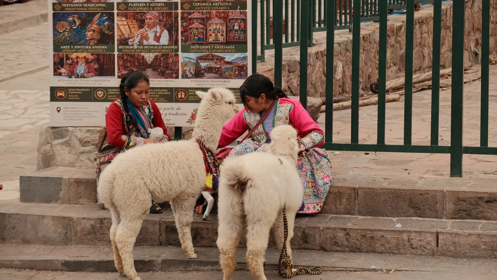 A wedding procession moves through Pisac's plaza, guests in formal dress among the crowd.