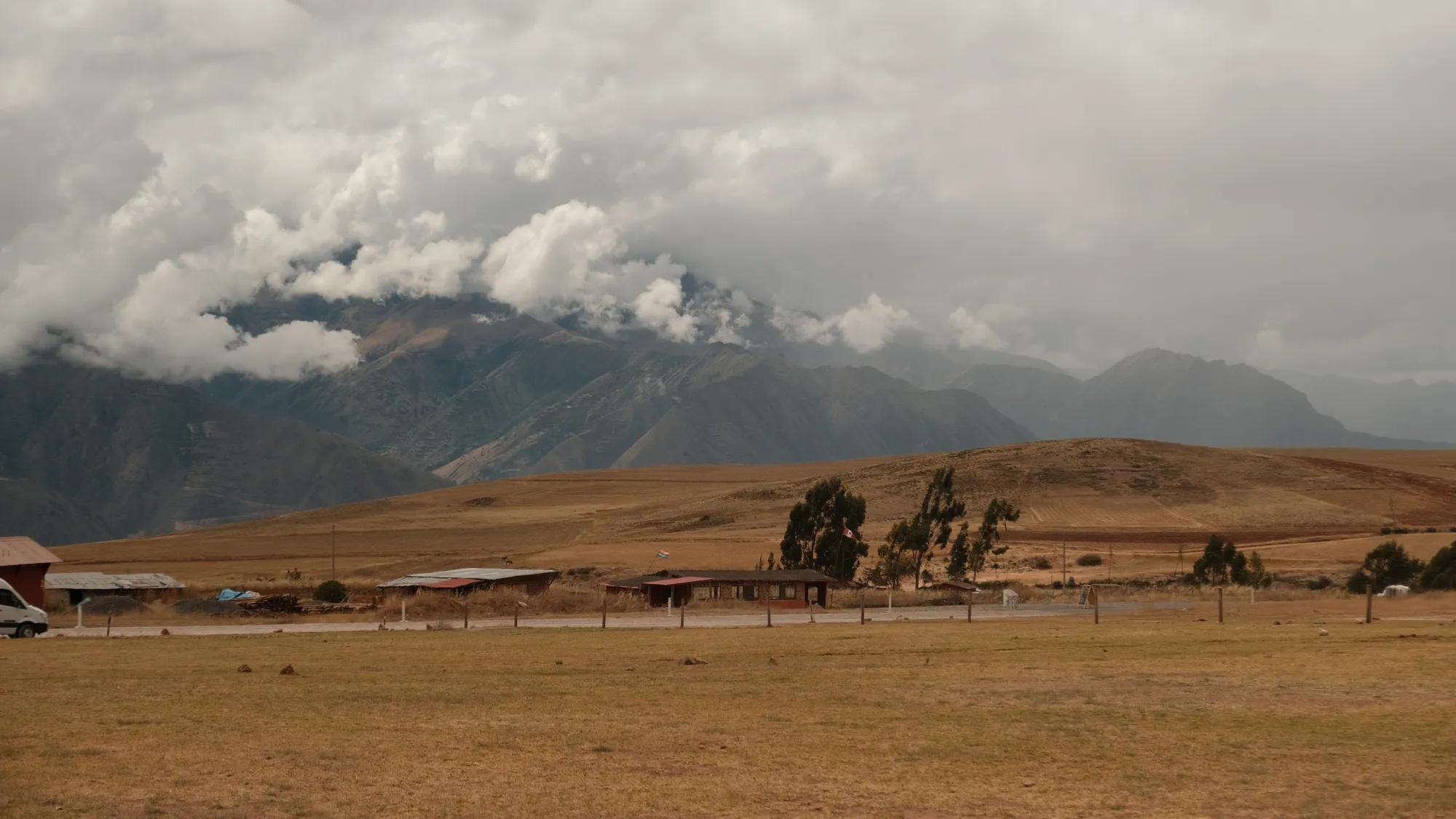 The Andean countryside around Moray, terraced hillsides and scattered farmhouses.